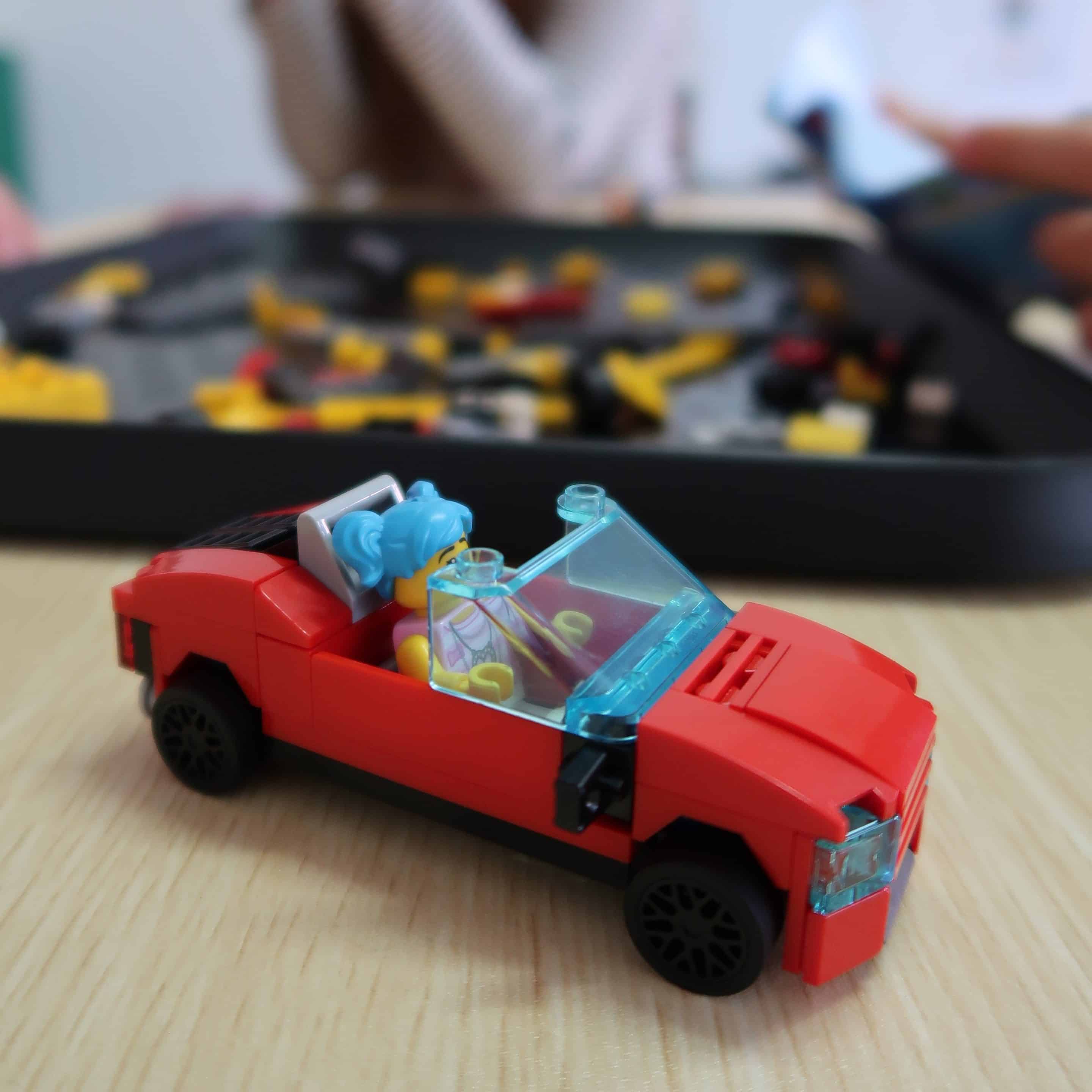 girl playing sensory toys on the floor